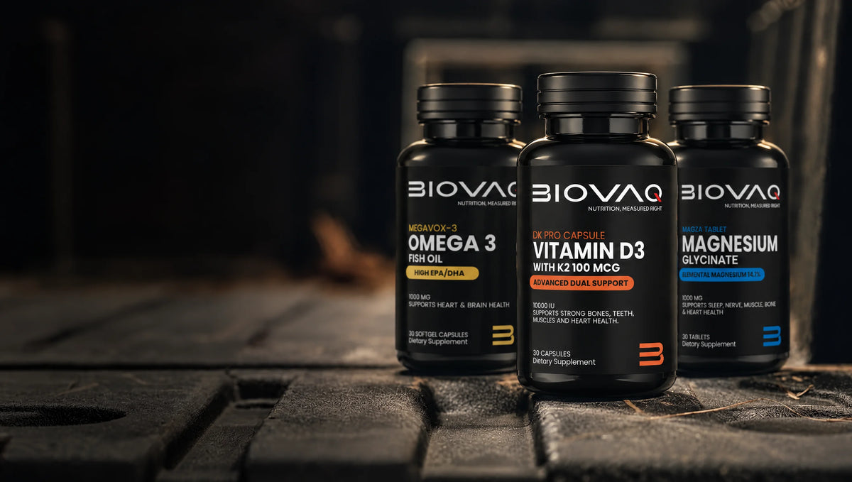 BIOVAQ Omega-3, Vitamin D3 + K2 and Magnesium Glycinate bottles on a dark wooden surface